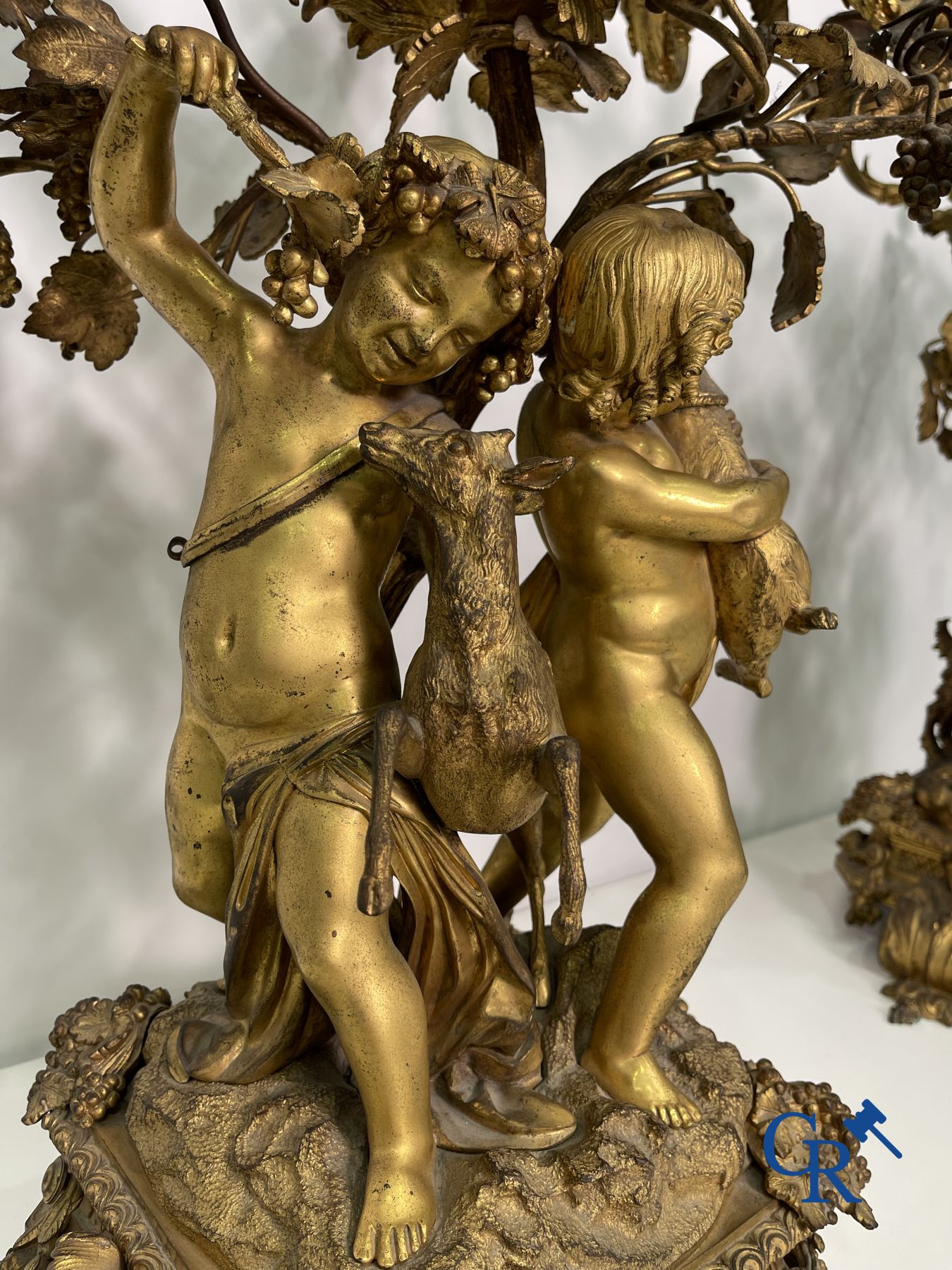 A pair of imposing bronze candlesticks with putti in LXVI style. Napoleon III period.