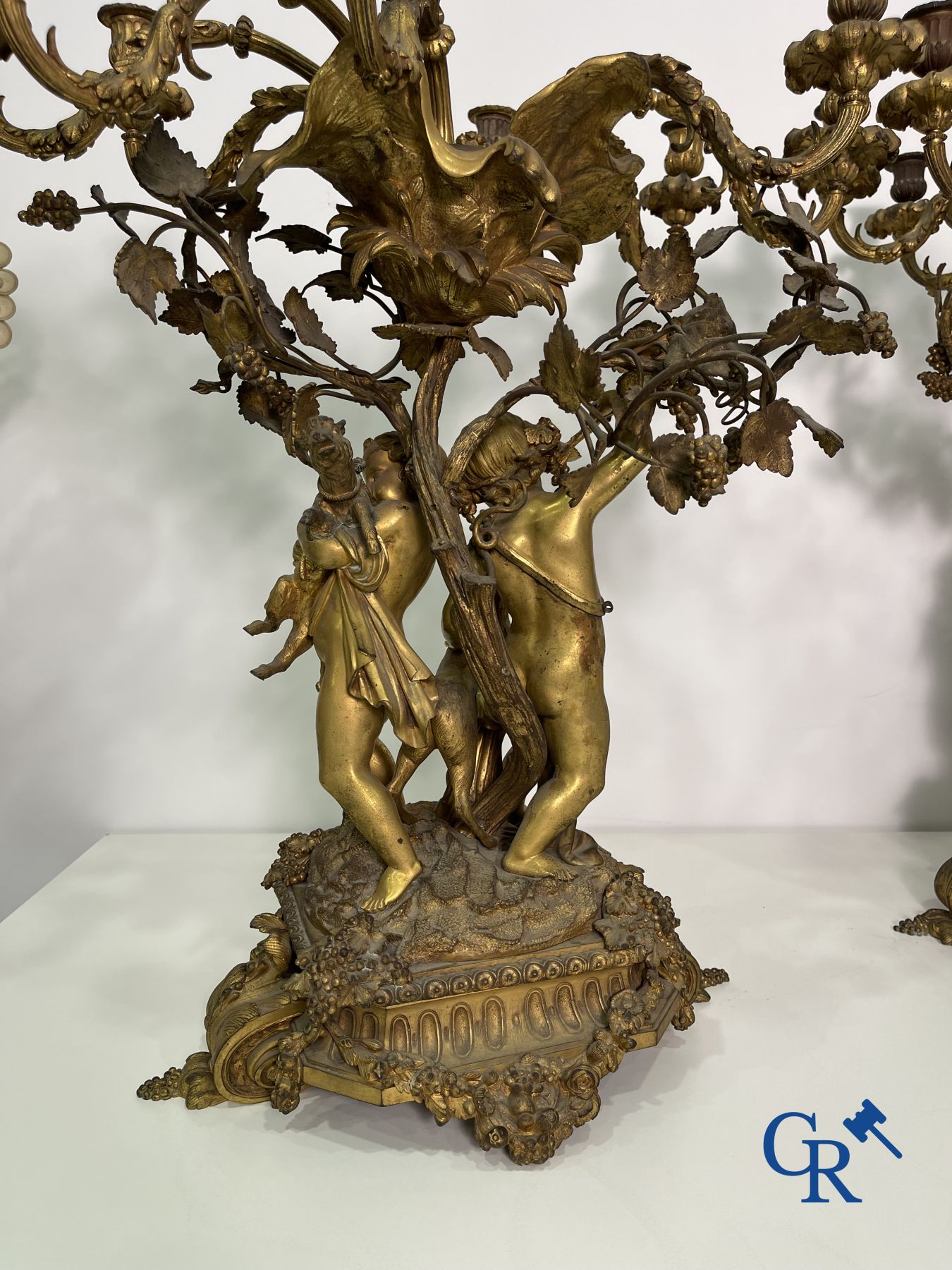 A pair of imposing bronze candlesticks with putti in LXVI style. Napoleon III period.