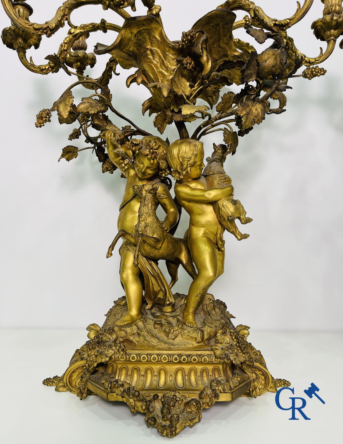 A pair of imposing bronze candlesticks with putti in LXVI style. Napoleon III period.