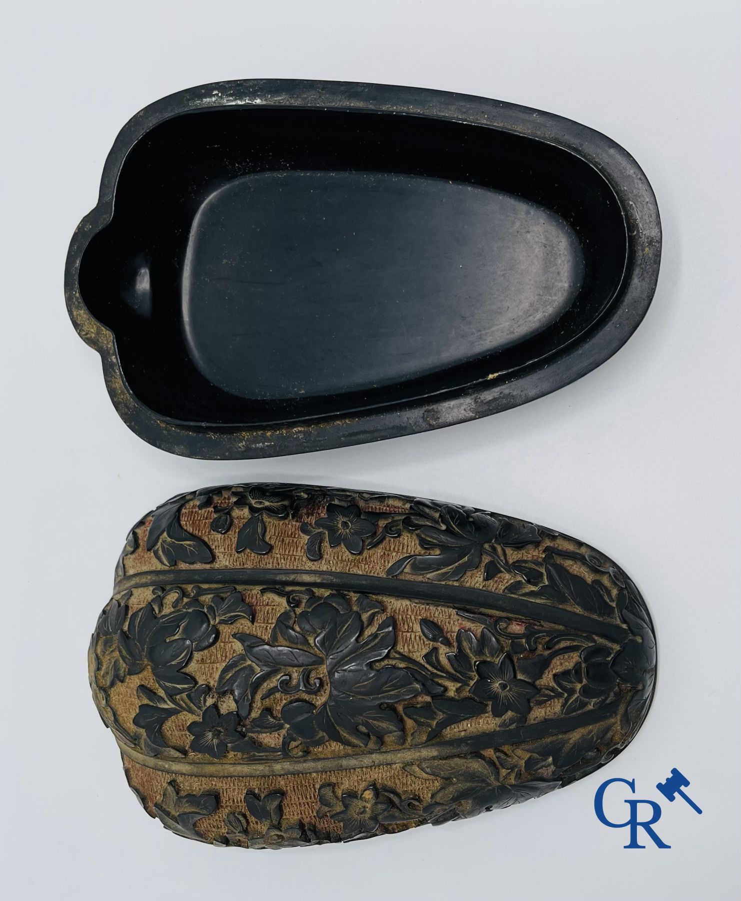 Asian Art: A finely carved Chinese lid box in black lacquer on a red background.