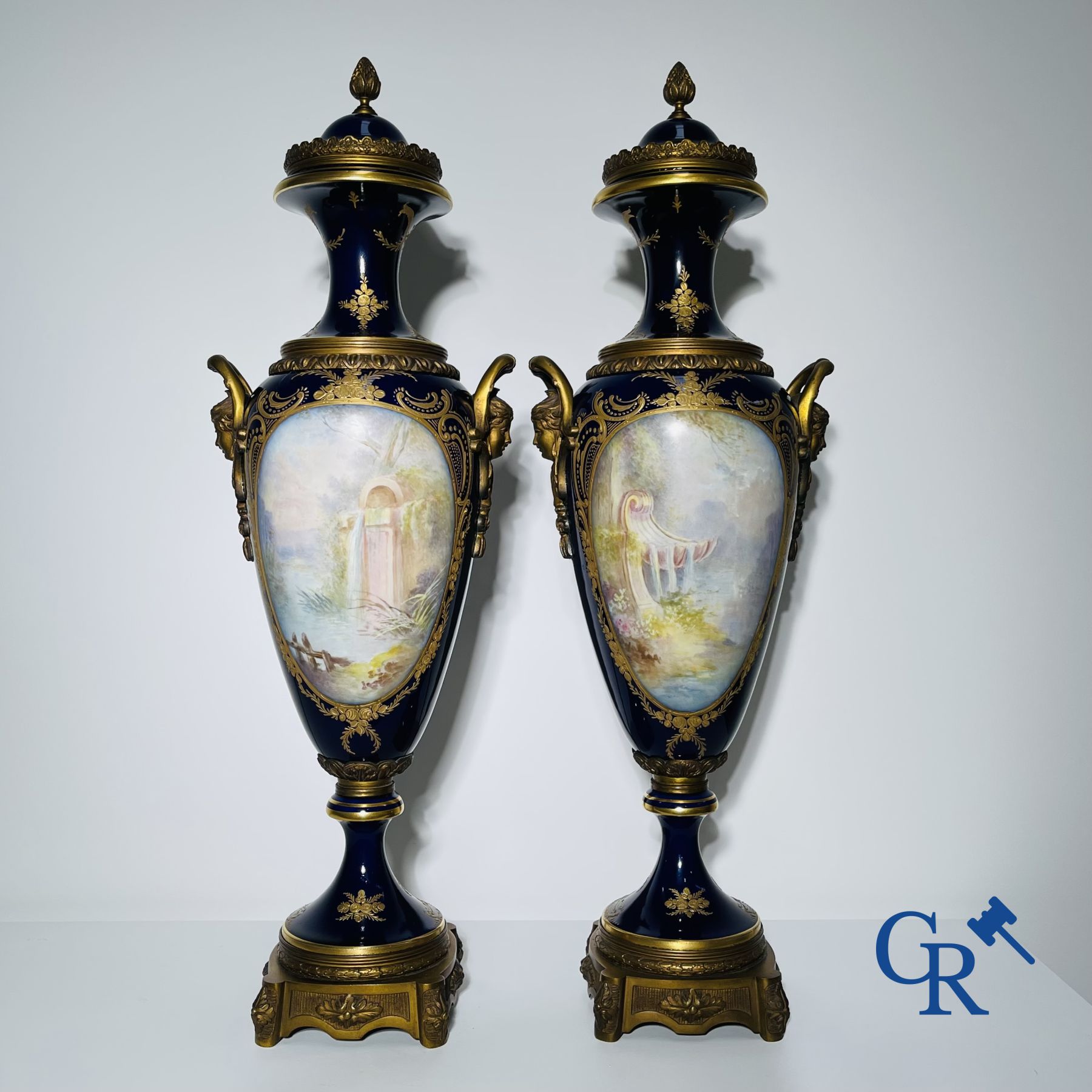 Porcelain: Sèvres: Pair of large bronze mounted vases in Sevres porcelain.