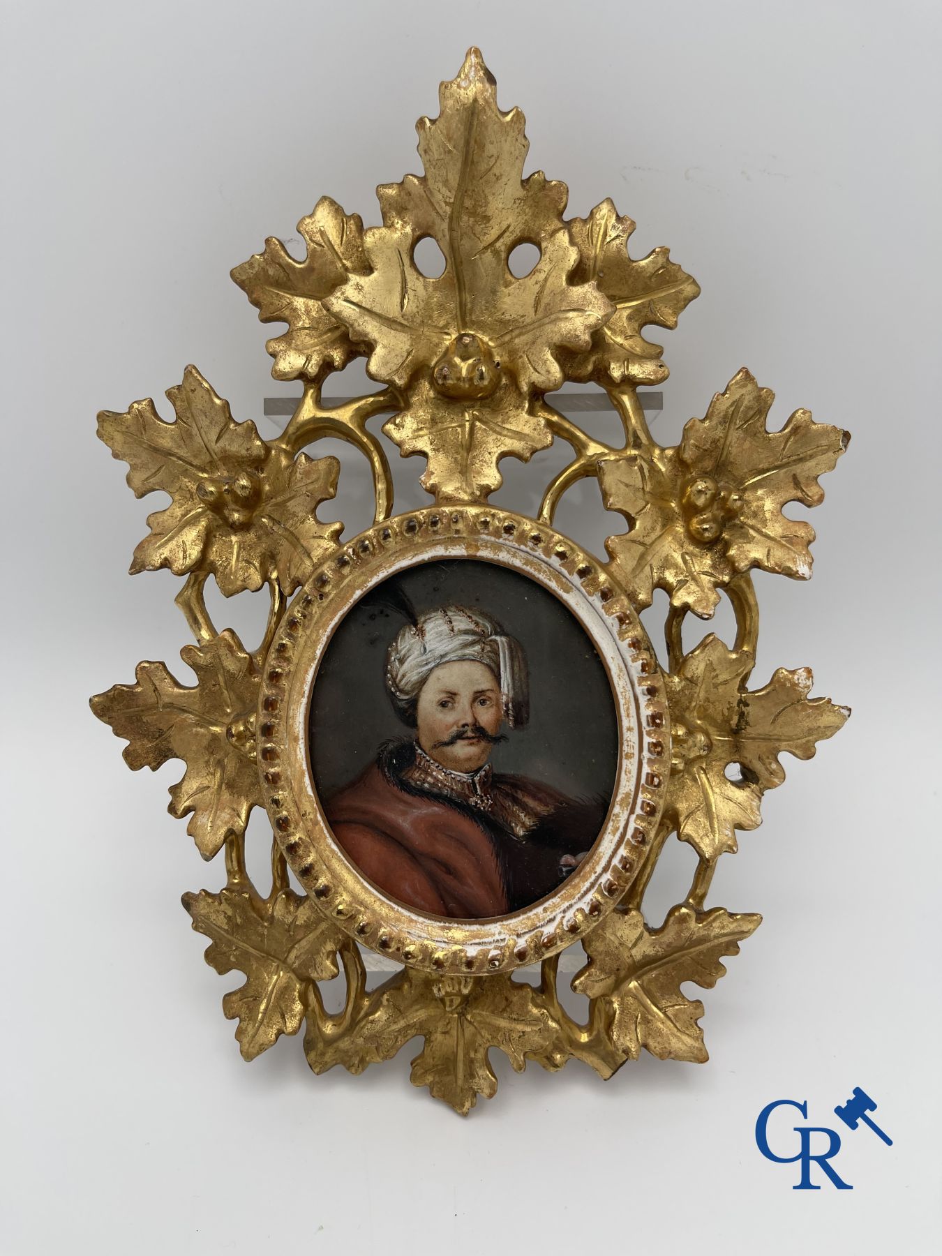 Miniature portrait in a gilded wood-carved frame. 19th century.